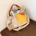 Beige canvas tote bag with orange and blue leather trim and adjustable shoulder strap - Khaki