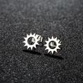 Minimalist silver sunburst stud earrings in stainless steel on black textured background - Sun / Steel