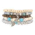Macro detail of multi-layer beaded bracelets featuring wooden beads and silver feather charm - Silver Feather Spot Bead (58)
