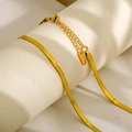 Macro detail of golden stainless steel snake chain with S.STEEL hallmark and lobster clasp - 4mm Width 40cm Length / Gold