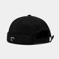 Detail of white heart embroidery on black cotton skullcap with adjustable metal buckle - Adjustable / Black