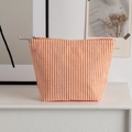 Portable seersucker toiletry bag with orange and white vertical stripes and zipper - Orange Stripes