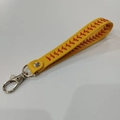 Detail of yellow faux leather baseball keychain with red V-stitching and silver metal clasp - Yellow Wristband Keychain (Keychain #2)