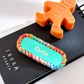 Handmade mint green Cute charm with multi-color knit border on a black notebook - Oval-Green