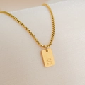 Detailed close-up of 18K gold plated box chain and rectangular pendant with letter S - Letter S
