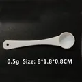 White 0.5g plastic measuring spoon with long handle and round hanging hole for powders - 0.5g (8*1.8*0.7cm) / White