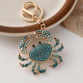 Portachiavi a forma di granchio dorato con strass blu oceano per borse e zaini - Blu