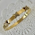 Elegant gold titanium steel cross X pattern bracelet with sparkling crystal pavé - Small X Design Gold Bangle