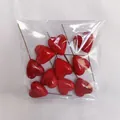 Pack of 10 shiny red heart cake toppers with thin metal rods for DIY flower arrangements - 40mm (Pack)