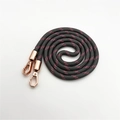 Detail of red and black woven crossbody strap with rose gold metal swivel carabiners - Long Style / Dark Gray
