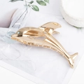 Golden dolphin-shaped metal hair claw clip featuring a blue rhinestone eye accent - Dolphin Shape Gold B3330