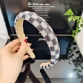 Detailed close-up of a rhinestone padded headband with leopard and checkered patterns - 2.5cm Checker Rhinestone Padded Headband [Black/White Checker]