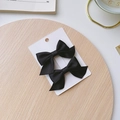 Pair of elegant black bow hair clips for girls displayed on a minimalist white card - Black Bow 2-Piece Set