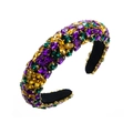 Dettaglio di cerchietto barocco con strass colorati e castone in metallo dorato - Viola