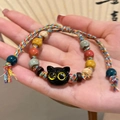 Handmade woven bracelet with colorful ceramic beads and a cute black cat pendant charm - Black Cat Charm Multi-color Braided Bracelet