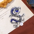 Vintage silver dragon brooch with deep blue rhinestones and white pearl accent - Silver with Blue Rhinestone