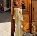 Detail of off-shoulder lace dress with elegant bell sleeves and bow tie neckline - Creamy Yellow