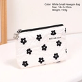 White floral quilted coin purse with black flower pattern and petal zipper pull - Small White Hexagonal Bag
