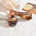 Porte-clés Capybara mignon avec bracelet en cuir marron et effet sable liquide - Capy-Coquille d'œuf