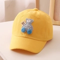 Close-up of yellow cotton baseball cap featuring 3D bear embroidery and Cool Dude tag - 52cm (2-5 Years) / Yellow
