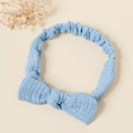 Detail of light blue bow headband featuring textured cotton fabric and elastic back - Sky Blue