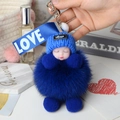 Schlafende Baby Puppe Schlüsselanhänger mit tiefblauem Pelz-Pompon und Strickmütze - Königsblau