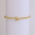 18K gold-plated beaded elastic bracelet featuring a polished Capricorn zodiac charm - Capricorn
