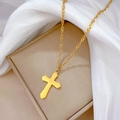 Elegant gold titanium steel cross necklace displayed on a beige jewelry box with silk - Gold