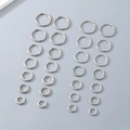 Polished silver stainless steel hoop earrings set in multiple sizes on grey background - 2mm Thickness-16mm Inner Diameter / Steel