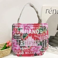 Pink floral canvas beach bag with white rope handles featuring Milano and Love motifs - Red Floral
