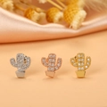 Detailed macro view of three cactus-shaped stud earrings in silver, gold, and rose gold - 12# Cactus