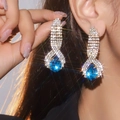 Elegant silver-toned long drop earrings with large blue gemstones and sparkling rhinestones - Silver Sapphire Drop Style (DTE1316605GL-NB)