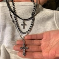 Three-layer cross pendant necklace with black leather cord and silver charms on model - Triple Layer Cross Style / Silver/Black