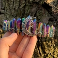Detail of a handmade rainbow crystal crown with silver moon and star pendant charms - Multicolor