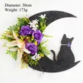 Detail of Halloween crescent moon cat wreath with purple roses and 30cm diameter size - Diameter 30cm / Trumpet Flower Cat Moon