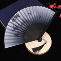 Chinese style folding fan with blue gradient silk surface and elegant black tassel - Style 38
