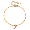 Detail of stainless steel bracelet with yellow beads and Christmas candy cane charm - Yellow