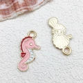 Roze emaille zeepaardje hanger met goudkleurig metaal voor DIY sieraden maken - 1pc Zeepaardje 9x20mm-0.7g