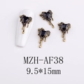 Detail of gothic gold nail charms with black heart stones and melting effect, size 9.5x15mm - AF38-Gold Black Heart Molten Charm