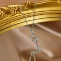 Silver-finished clover key pendant necklace featuring shimmering crystal pavé settings - Silver Clover Key Pendant