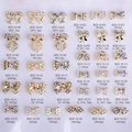 33 design di fiocchi per nail art in metallo dorato con perle e strass disposti in matrice - Oro / Stile Fiocco (8100)