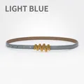 Slim light blue leather belt for women featuring a gold wavy buckle closure - Light Blue