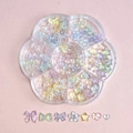 Pastel aurora resin nail art charms in a flower storage box featuring bows and stars - Plum Box B15-Transparent Aurora Mixed Shapes