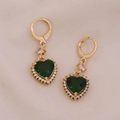 Detail of gold heart earrings featuring green gems surrounded by sparkling small crystals - Green