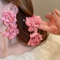 Close-up of pink satin fabric flower earrings showing layered petals and texture - Warm Pink Double Satin Flower (111# Silver Needle)
