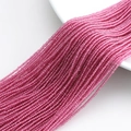 Strand of faceted pink crystal glass beads with smooth 32-cut surface on a white plate - 1MM String Approx 190pcs (Actual Size 2MM) / Rose Red