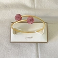Brazalete rígido de cuerda torcida en acero dorado con dos esferas de cristales rosas - Dorado/Rosa