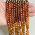 Strands of translucent amber round glass beads for DIY jewelry making and crafting - Amber Glass Beads