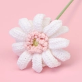 Detailed macro view of handmade crocheted gerbera daisy with white petals and pink center - Cute Four-flower Afghan African Daisy Branch - White