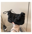 Detail of black quilted cloud bag with glitter finish and elegant pleated shoulder strap - Black